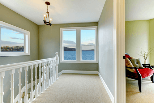 interior of a freshly-painted upstairs hallway with a beautiful ocean view