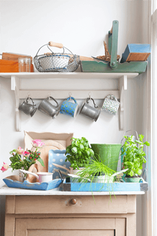 potted flowers and herbs add lively color to a garden workbench with country charm